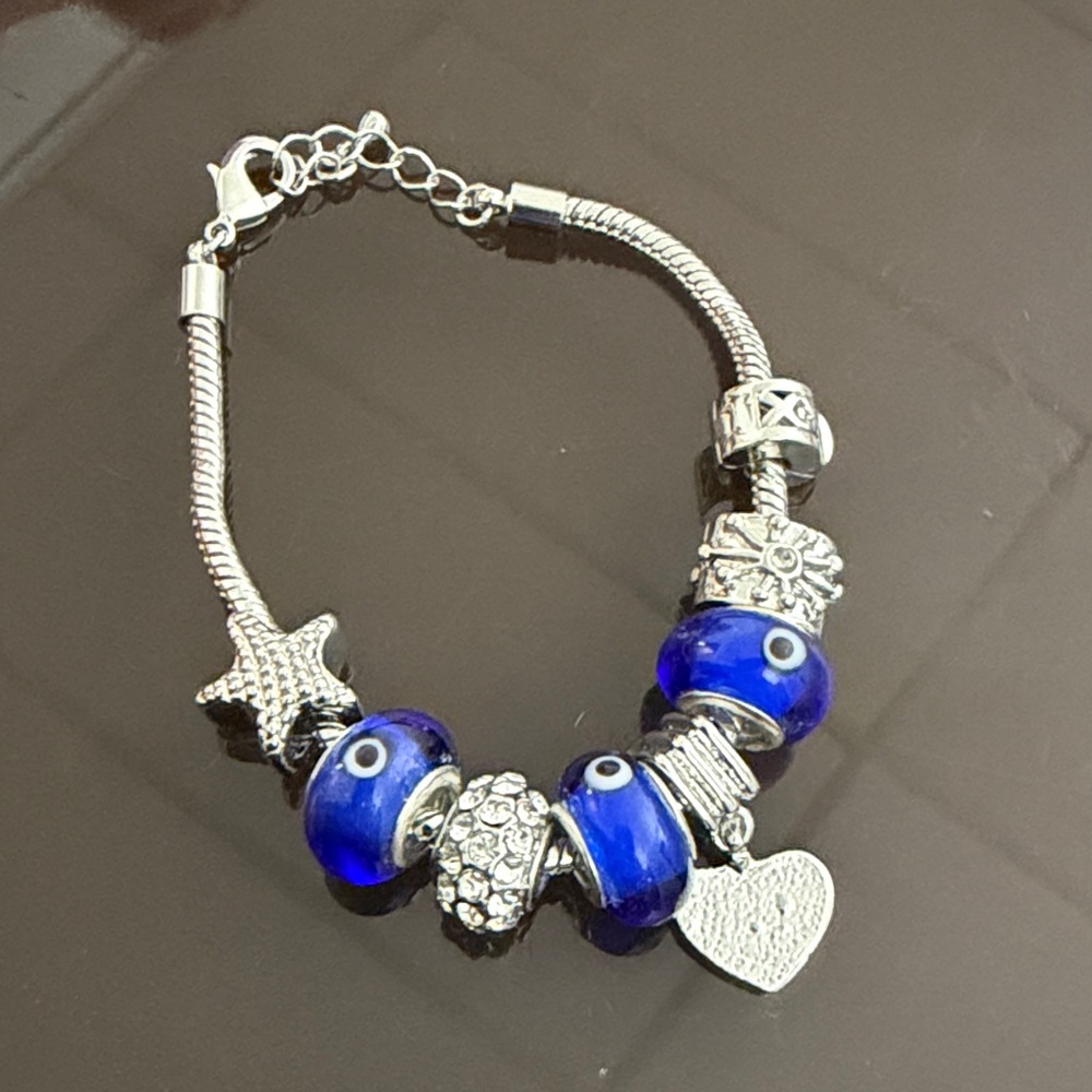 Silver Bracelet with Blue Evil Eye Beads and Charms